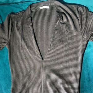 S/M black bodysuit. Deep neckline. Short sleeve.